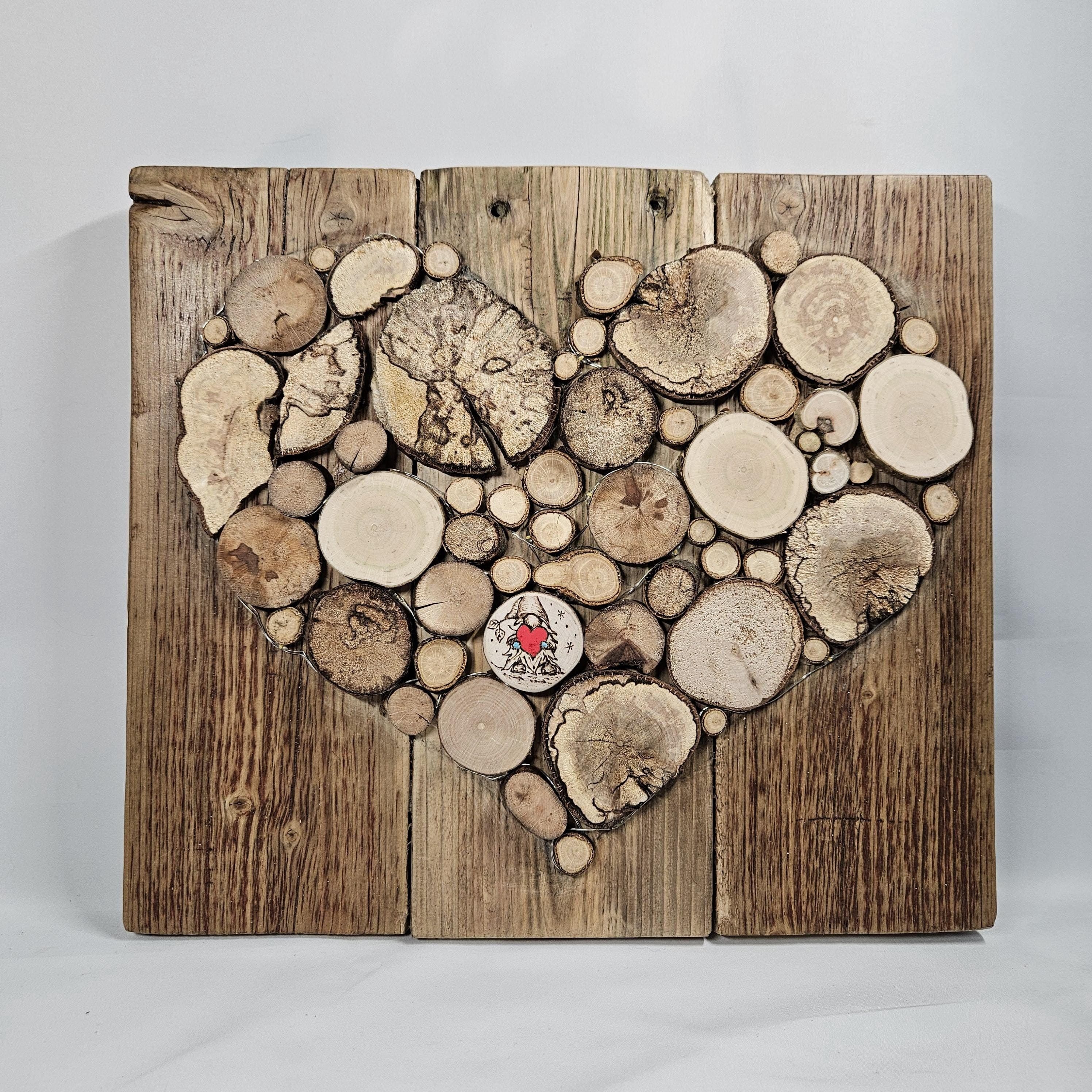 Wood Slice Mosaic featuring Pyrography Detail and Heart Design, made in Wotton-under-Edge, Gloucestershire, by Bough & Burrow